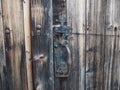 Detail of the old wooden door of a barn, in the French countryside Royalty Free Stock Photo