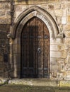 Old wooden door at Hexham Abbey, Northumberland, UK Royalty Free Stock Photo