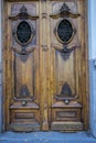 Old wooden door with iron knockers