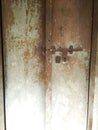 Old wooden door with latch. Royalty Free Stock Photo