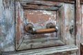Old wooden door with a lock.
