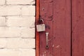 Old wooden door locked with padlock Royalty Free Stock Photo