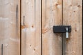 Old wooden door locked with padlock. Wooden background. Royalty Free Stock Photo