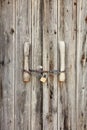 Old wooden door locked with rusty chain and a padlock Royalty Free Stock Photo