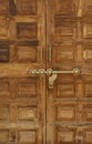 Old wooden door with a massive brass lock, India