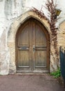 Old wooden door from medieval era found in Alsace Royalty Free Stock Photo