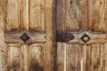 An old wooden door with metal handles