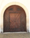 Old wooden door with metal handles