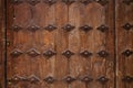 Old wooden door with metal ornate background Royalty Free Stock Photo