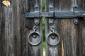 Old wooden door with metallic padlock