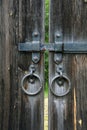 Old wooden door with metallic padlock