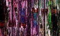 Old wooden door with multi coloured paint Royalty Free Stock Photo