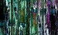 Old wooden door with multi-coloured paint Royalty Free Stock Photo