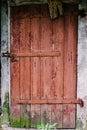 Old wooden door is not closed on the lock. Peeling paint. House. Royalty Free Stock Photo