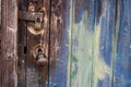Old wooden door with paint, handle and lock