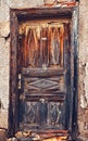 Old wooden door with peeled paint Royalty Free Stock Photo