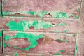 Old wooden door with peeling paint from planks Royalty Free Stock Photo