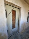 Old wooden door before replacement with new plastic windows and doors Royalty Free Stock Photo