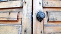 Old wooden door with a round iron knob Royalty Free Stock Photo