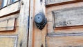 Old wooden door with a round iron knob Royalty Free Stock Photo