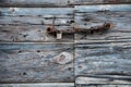 Old wooden door with rusty chain and padlock Royalty Free Stock Photo