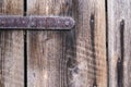 Old wooden door with rusty hinge, close-up Royalty Free Stock Photo