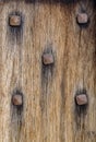 Old wooden door with rusty nails like number five domino
