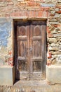 Old wooden door. Serralunga D'Alba, Italy. Royalty Free Stock Photo
