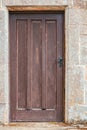 Old wooden door set in stone Royalty Free Stock Photo