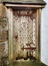 Old Wooden Door with Rusty Hinges and Handle Royalty Free Stock Photo