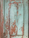 Old wooden door with shabby turquoise paint Royalty Free Stock Photo