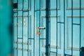 Old wooden door with a shadow pattern on its surface, outdoors. Royalty Free Stock Photo