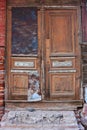 Old wooden door in a stone house Royalty Free Stock Photo