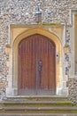 Old wooden door with stone surround