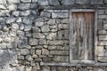 Old wooden door in a stone wall Royalty Free Stock Photo