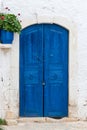 Old wooden door on stone wall. Royalty Free Stock Photo