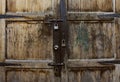 Old wooden door with two lock of keys Royalty Free Stock Photo