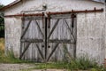 Old wooden door of walled barn Royalty Free Stock Photo