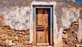 Old wooden door and weathered stone wall frame ancient building generated by AI Royalty Free Stock Photo
