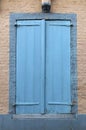 Old wooden door and window on the brick wall background Royalty Free Stock Photo