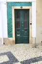 Old wooden door with wrought iron details