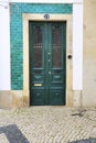 Old wooden door with wrought iron details