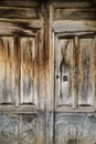 Old wooden door with wrought iron details Royalty Free Stock Photo