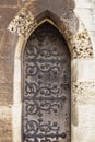 Old wooden door with wrought iron details Royalty Free Stock Photo