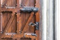 Old wooden door with wrought iron handle Royalty Free Stock Photo