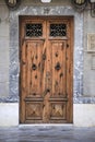 Old wooden door with wrought iron door knockers Royalty Free Stock Photo