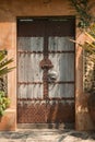 Old wooden doors that are closing outside the house are rusting metal. Constitute Chinese style