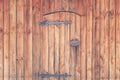 Old wooden doors with forged hinges and a lock Royalty Free Stock Photo