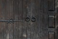 Old wooden doors with forged round handles Royalty Free Stock Photo