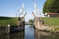 Old wooden drawbridge at entrance to harbour schoonhoven on river lek